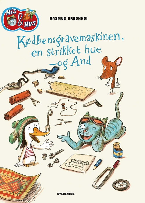 KØDBENSGRAVEMASKINEN, EN STRIKKET HUE - OG AND